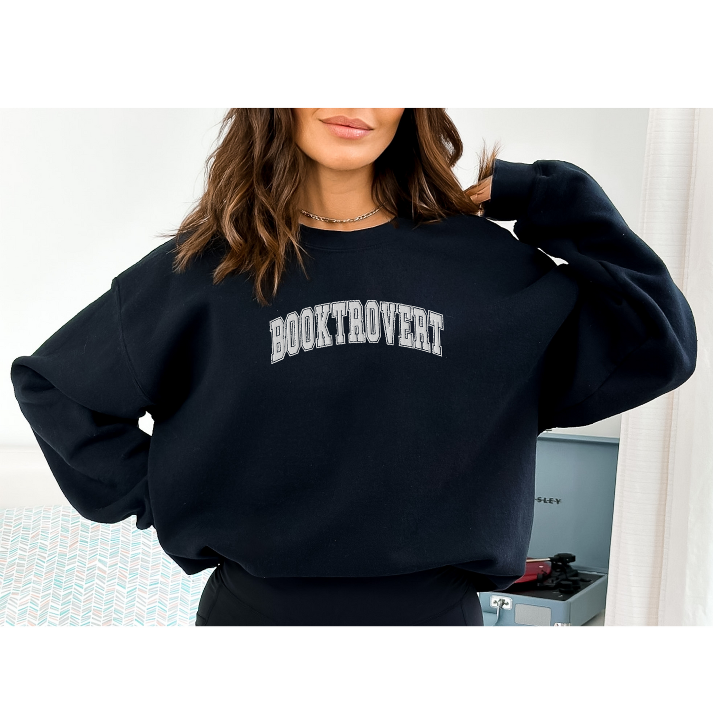Wrap yourself in literary charm with our "Booktrovert" Embroidered Sweatshirt.