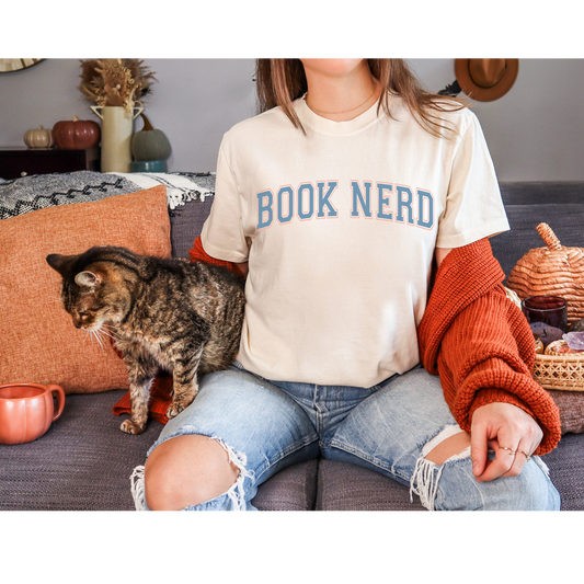 Make this tee your go-to choice for stylishly expressing your bookish passions. Get yours now and wear your "Book Nerd" title with panache!