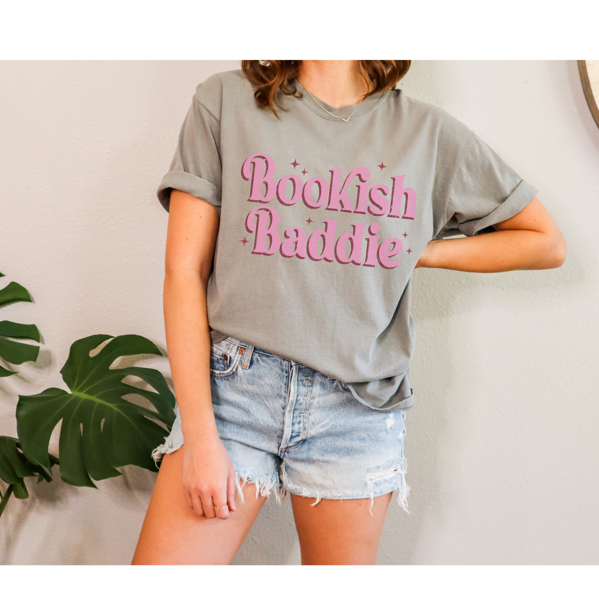 Elevate your bookish style with our "Bookish Baddie" Graphic Tee. This eye-catching piece combines a pop of pink with an empowering message, creating a fun and uniquely fashionable look that's perfect for all the confident book lovers out there.
