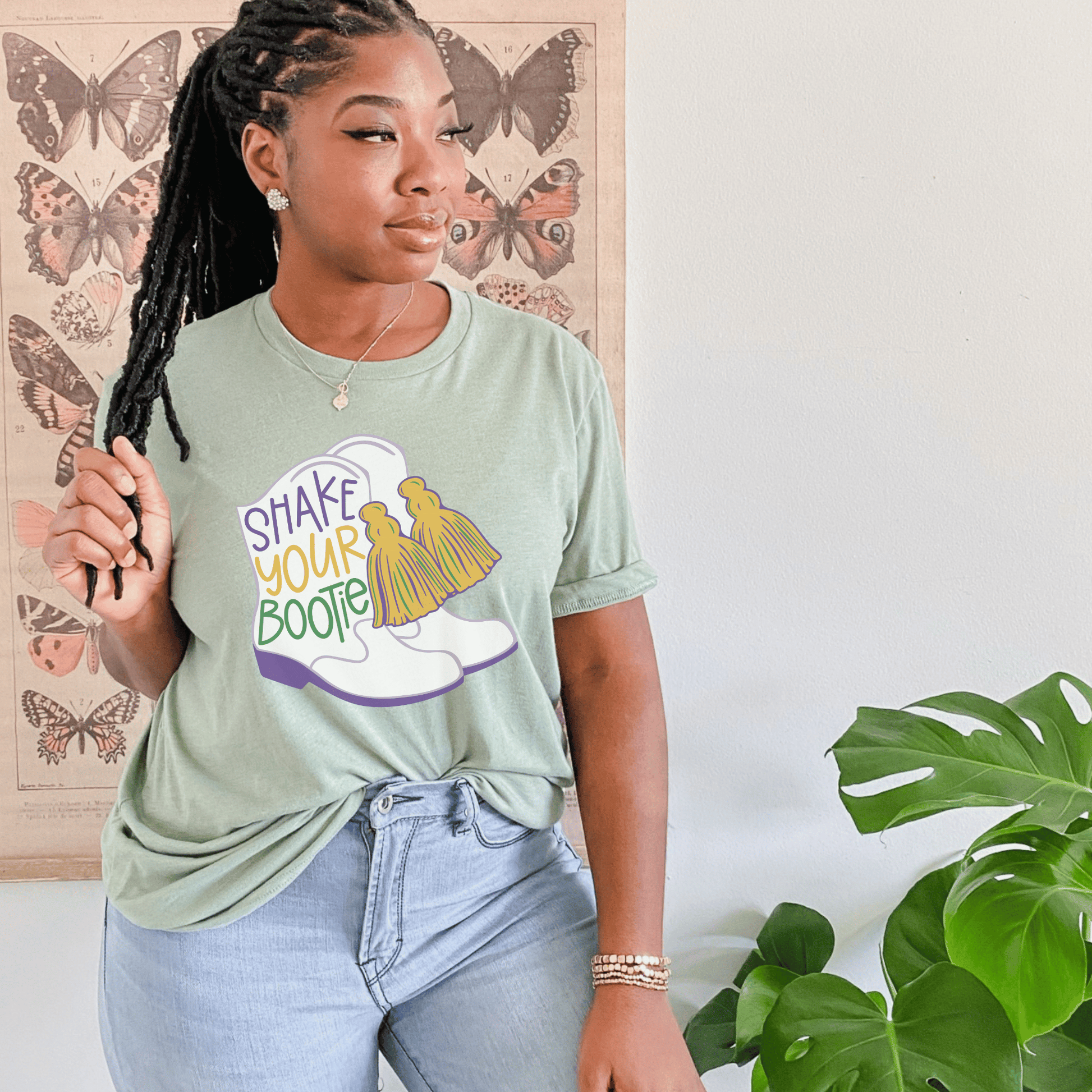 green mardi gras shirt that says shake your bootie featuring classic majorette boots