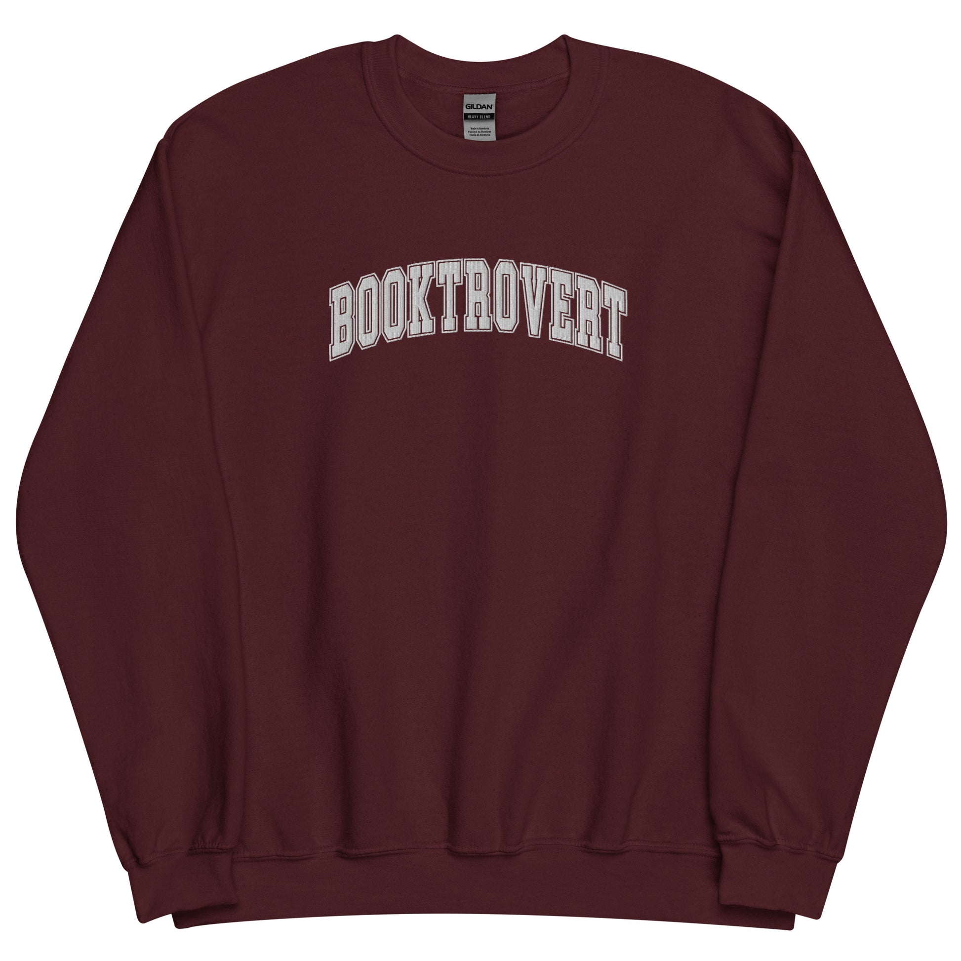 Introducing our "Booktrovert" Embroidered Sweatshirt – the epitome of cozy sophistication for introverted book lovers who find solace in the world of words.